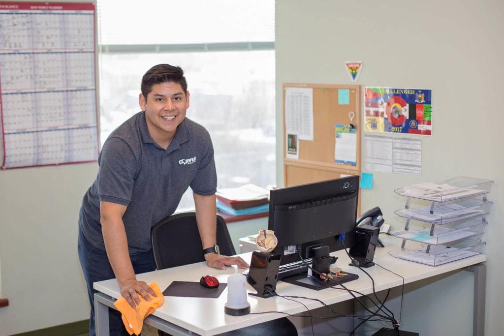 Corvus Franchisee cleaning an office to desk to prevent allergies